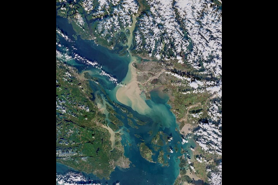 Chris Hadfield shared a photo of the increased flow of silt and debris flowing into the Strait of Georgia after B.C.'s recent flooding. 