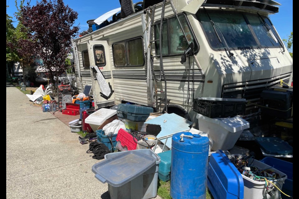 The city is trying to move a group of people living out of their RVs along Slocan Street.