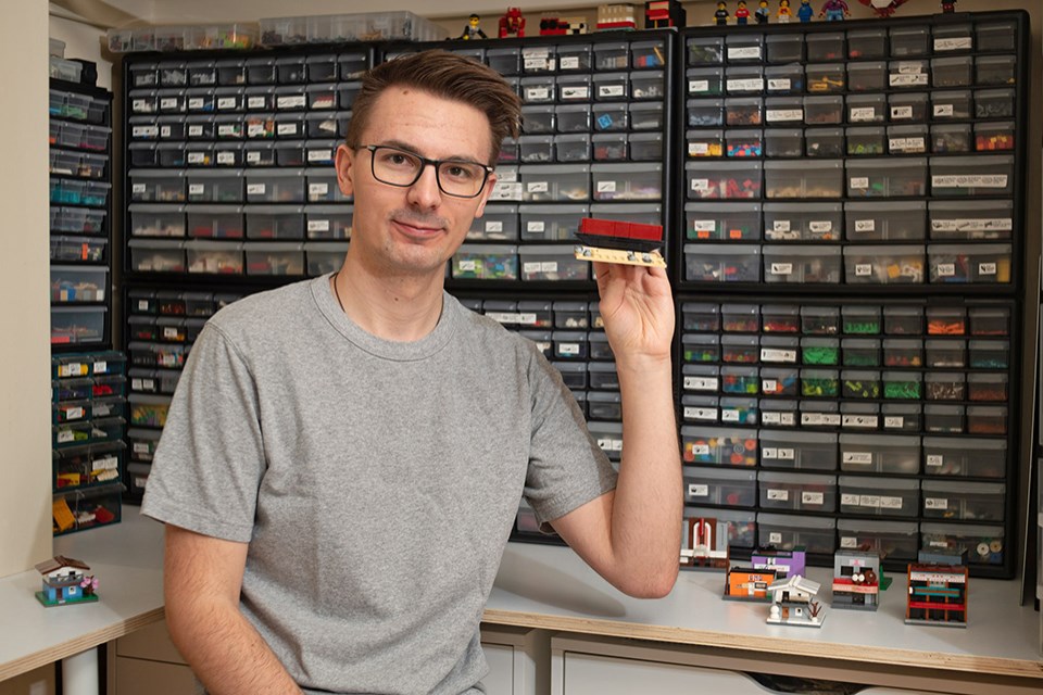 Alex Saar of Heritage Bricks holds his English Bay Barge creation