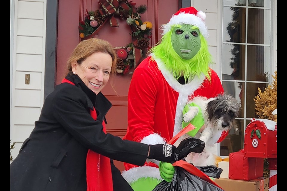 A Crime Stopper representative thwarts "The Grinch" from stealing packages
