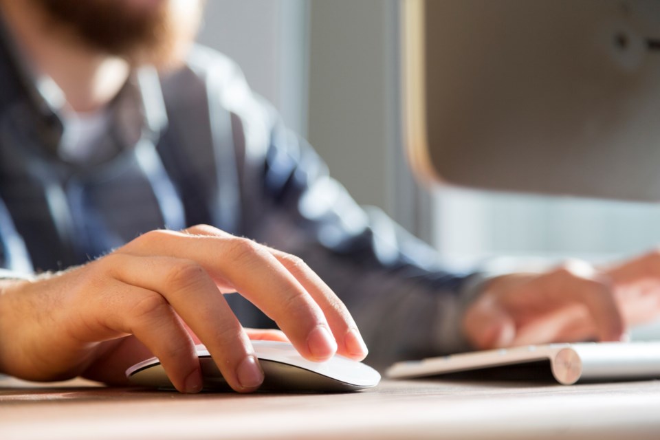 man-with-hand-on-mouse