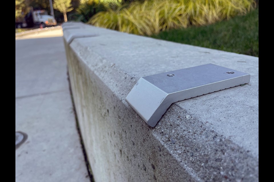 A skate stopped ledge outside of a condo development