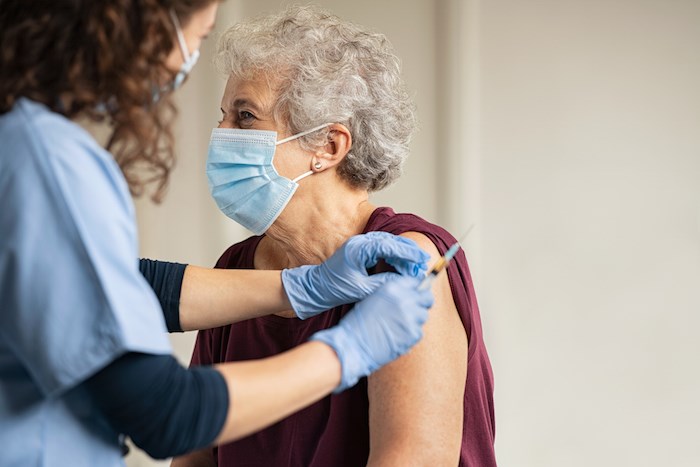 senior-woman-receiving-covid-vaccine-getty