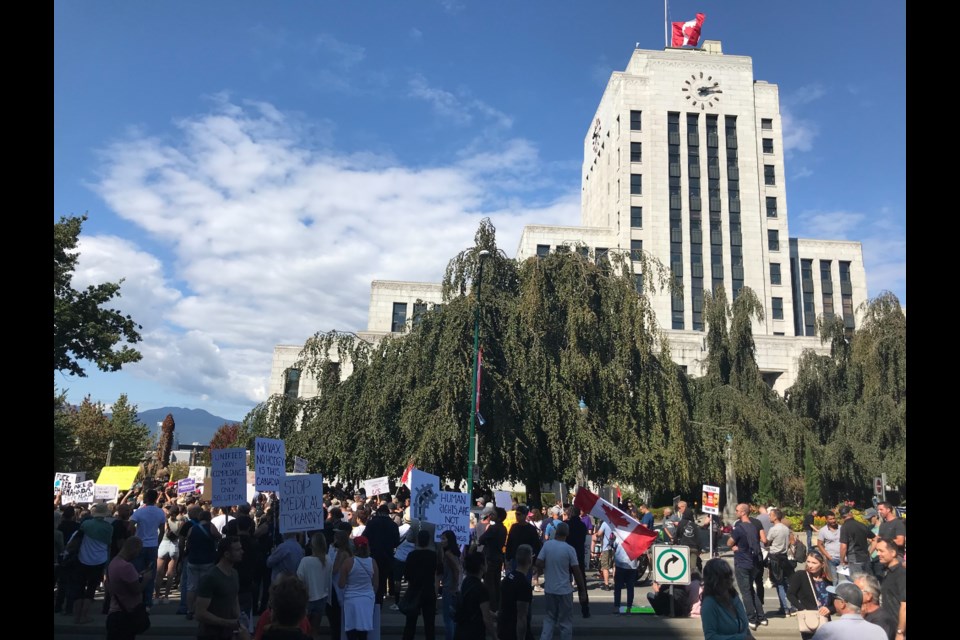 Hundreds of anti-vaccine protestors gathered outside Vancouver City Hall on Wednesday, Sept. 1.