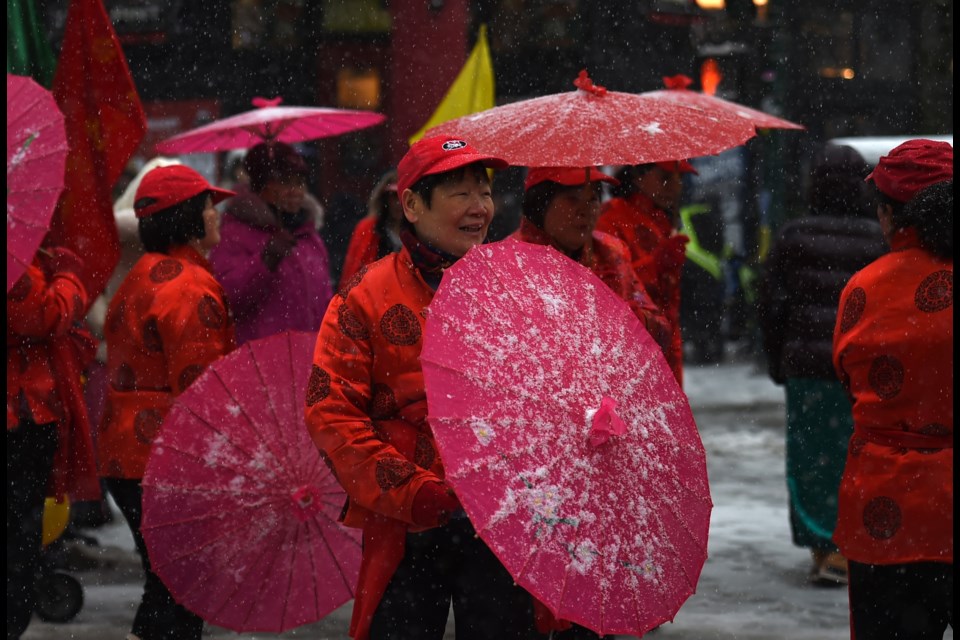 Some who had umbrellas for performances also used them to keep the snow off their head.