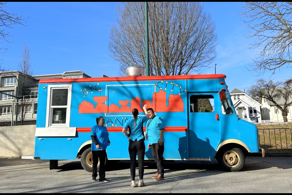 Marissa, Hannah, and Raymond Yamelst hanging out with the Big City Bannock truck.