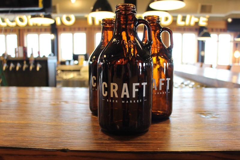 Growlers on the bar upstairs.