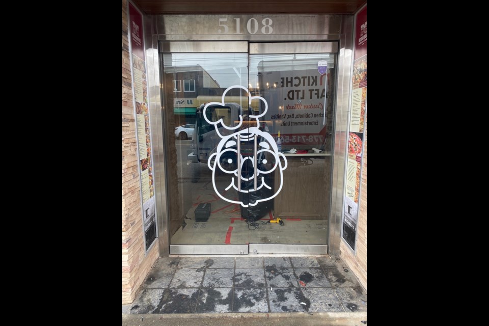 The caricature on the entrance of Neighbour’s Restaurant's new home is that of family patriarch “Papa George” Tsoukas, the original owner.