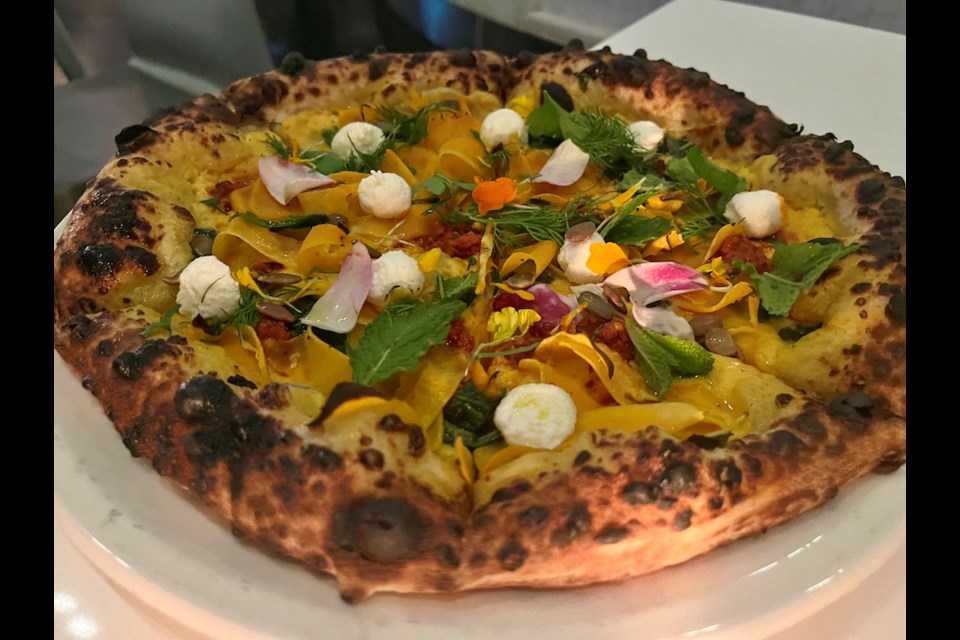 Opened in early 2023, Gastronomy Gastown's menu centres on inventive pizzas, including special features like this early spring creation that has squash, nduja, fresh herbs, and whipped goat cheese