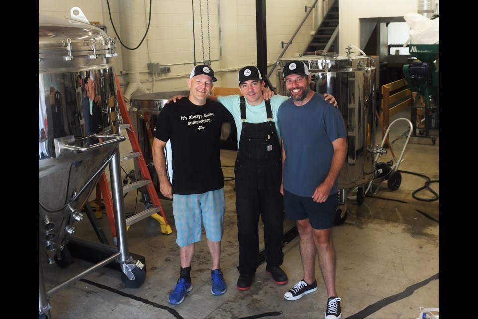 From left to right: Tate Lillies, Travis Rea, and Adam Jones are the three men behind the beach-y Brewing August. 