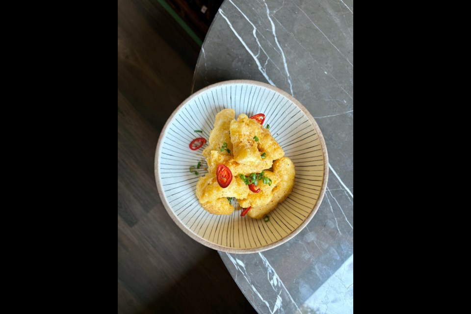 Salted egg yolk fried squid joins the menu at the new Heritage location in Vancouver