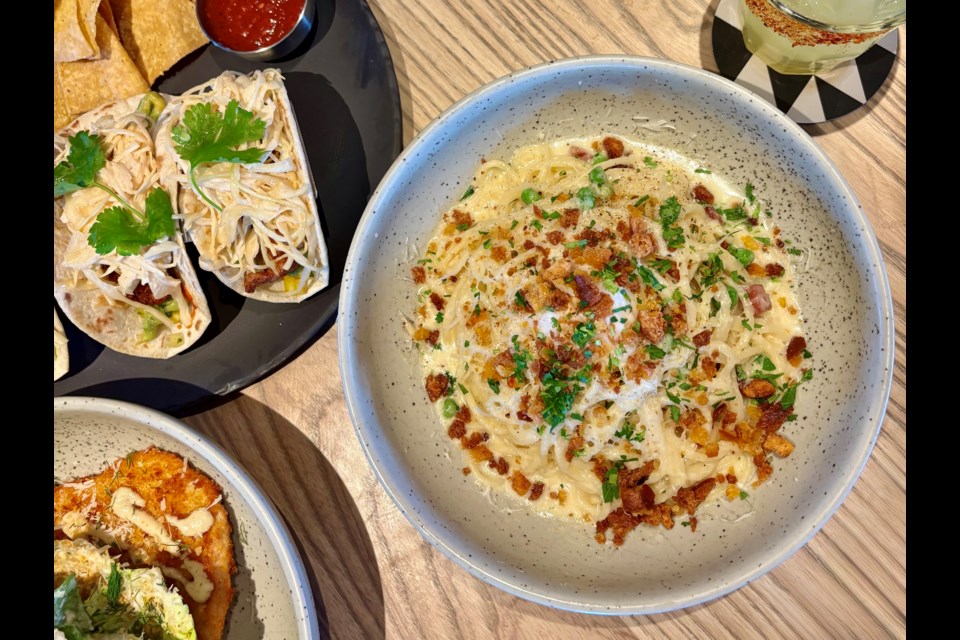 King Taps, the "unbuttoned" sibling to the Cactus Club, has opened its first Metro Vancouver location, with a sprawling indoor-outdoor space in the Willowbrook mall complex in Langley.