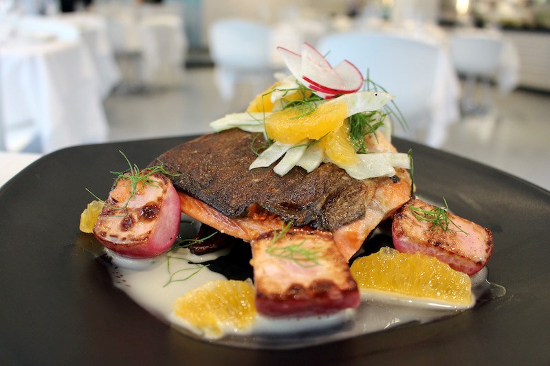 Sous vide salmon is finished with crispy skin, and is beautifully presented