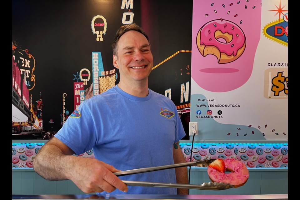 Mike McBean (left) and a Flamingo donut. McBean is the man behind Vegas Donuts, Vancouver's newest donut shop, which he operates with his brother, Steve.