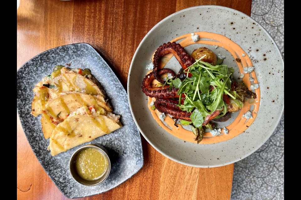 Prawn tacos, left, and Pulpo a la Brasas, a fiery marinated and chargrilled octopus dish