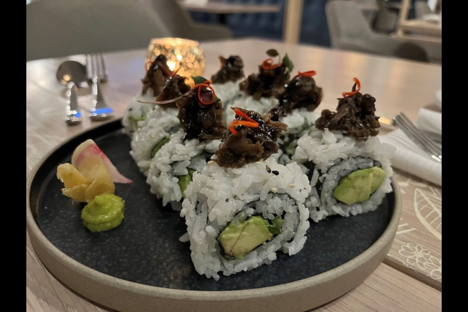The Nightshade Roll is a maki roll with avocado and cucumber on the inside and eggplant on top