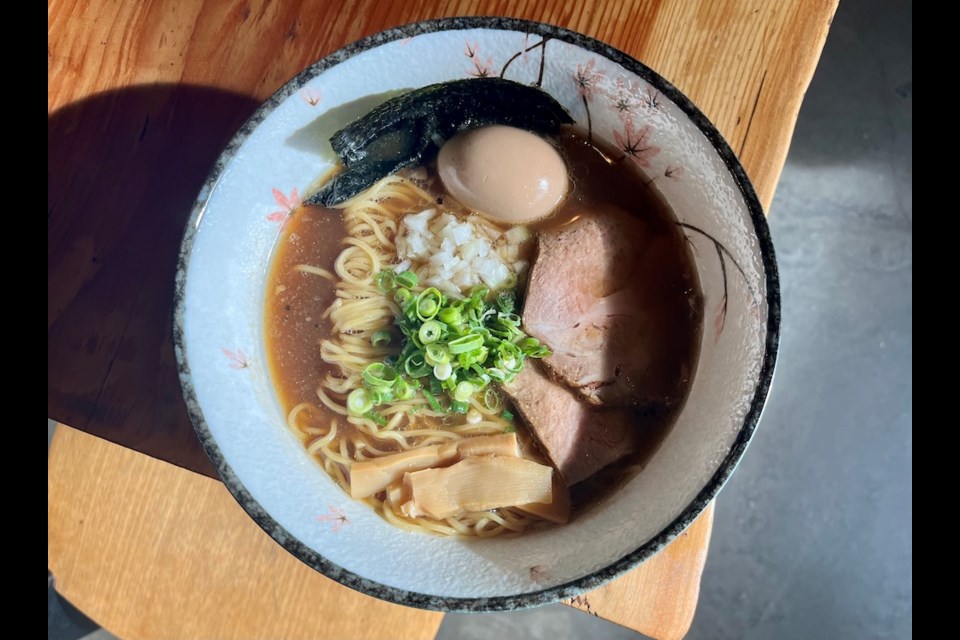 The Ramen Club, a onetime roaming pop-up, is now operating out of a restaurant space in Vancouver's Olympic Village. One of their signature bowls is Nibo Ramen, which uses niboshi - dried sardine - paste to build on a clear, light chicken dashi broth.