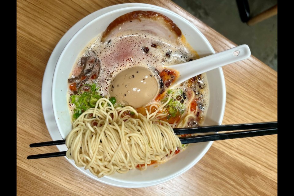 The Kara Tori Paitan is a spicy chicken broth-based ramen with thin noodles and tender chashu pork, sous vide chicken breast pieces, green onion, and ramen egg. It's one of four options on the menu of Ramen Kounotori, which opened in mid-August on Main Street in Vancouver.