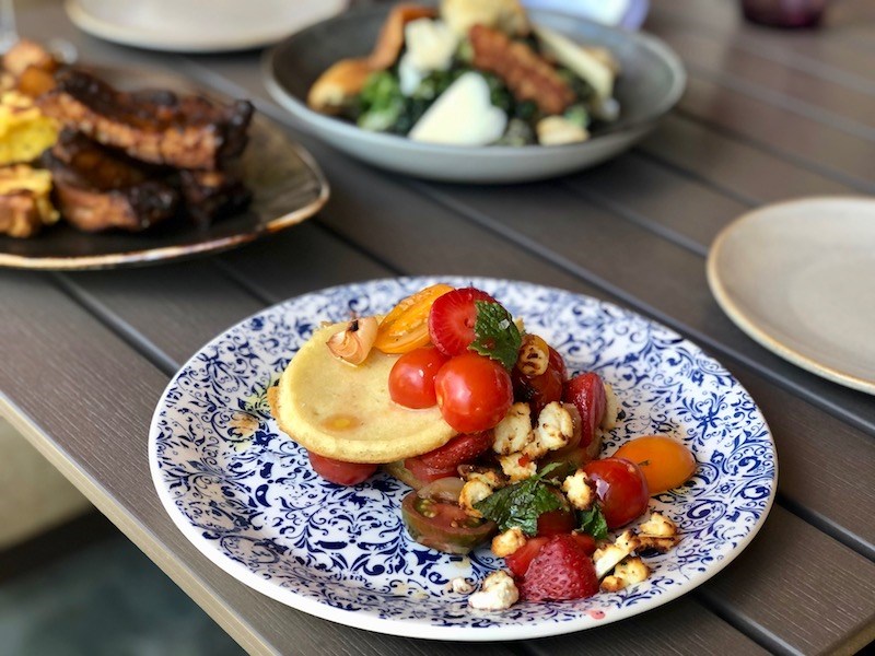 A special feature dish of grilled crumpets with goat cheese, tomatoes, strawberries, and balsamic is one of the many wildly creative - and wildly successful - dishes on the lunch menu at Roar