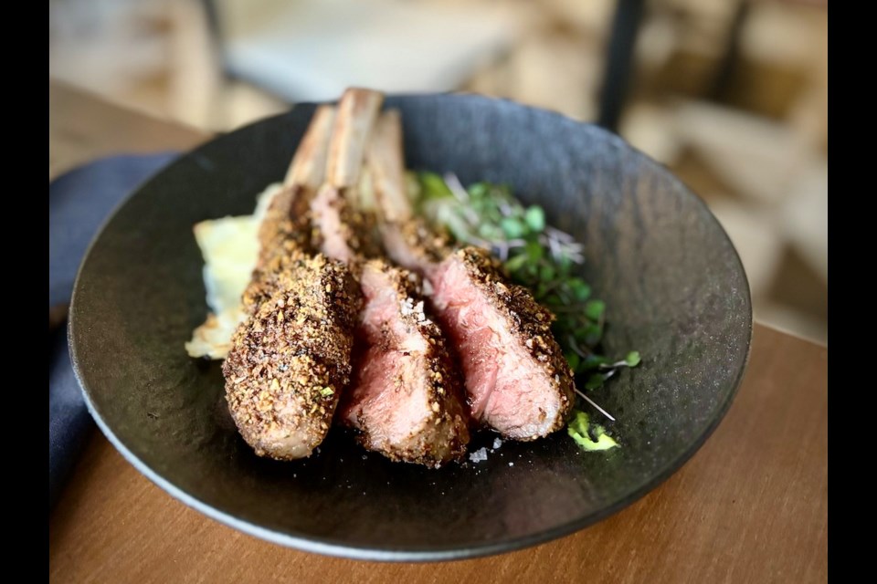 The essence of a quintessential English lamb with mint sauce is reflected in a pistachio-crusted rack of lamb with pea puree and gratin dauphinoise