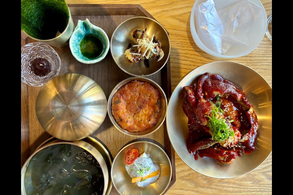 The spicy raw marinated crab lunch set at Jinmi. The Korean restaurant is moving to where it began, on Cambie Street at Hotel Blu, however, the business owners will keep the Denman space to open Jinmi Juga, a Korean-style pub. Both spots will debut in June 2025.