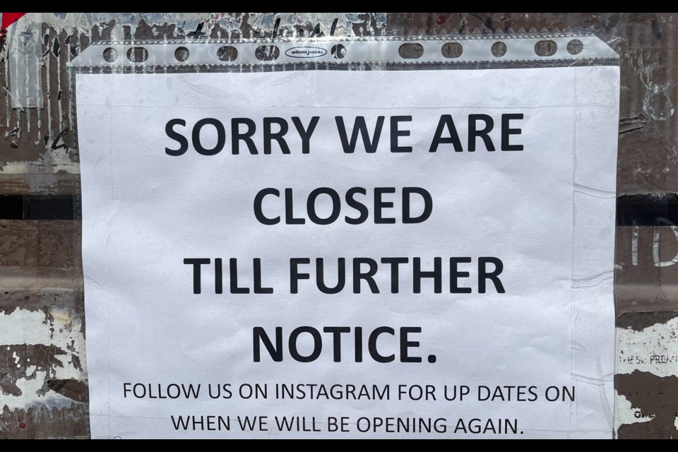 A sign on the door at Storm Brewing explains they are temporarily closed.