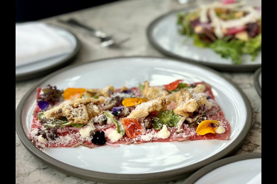 Wildlight Kitchen + Bar in Vancouver's West Point Grey earned a spot on the Michelin Guide's list of recommended restaurants in the city in 2023. Chef Warren Chow, behind dishes like a Brant Lake Wagyu Beef Carpaccio, also won the Guide's first-ever Young Chef Award.