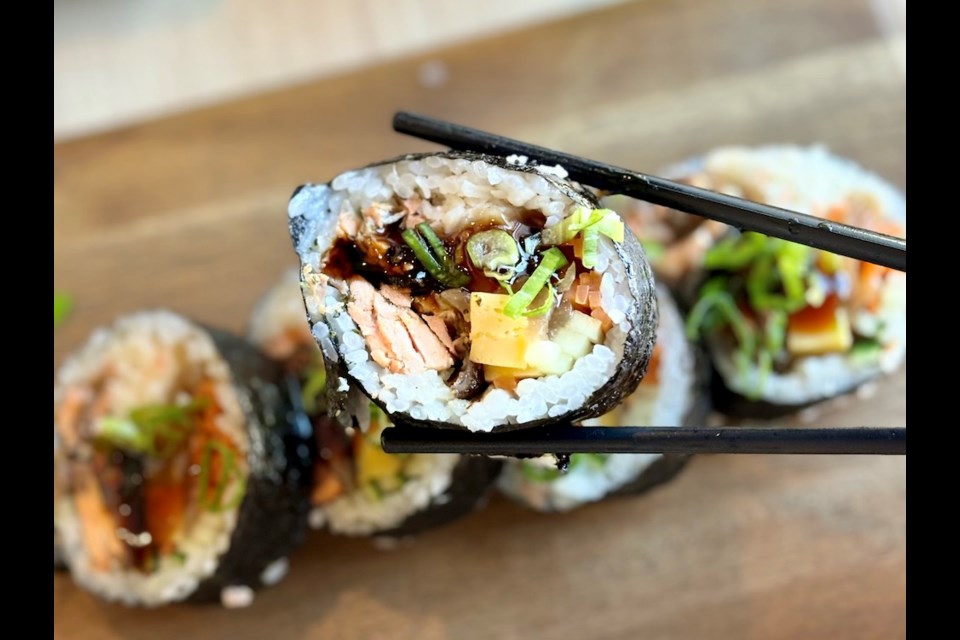 The B.C. futomaki roll at Yume features cooked salmon and pickled veggies. The new restaurant's menu features several sushi dishes, including the large futomaki rolls