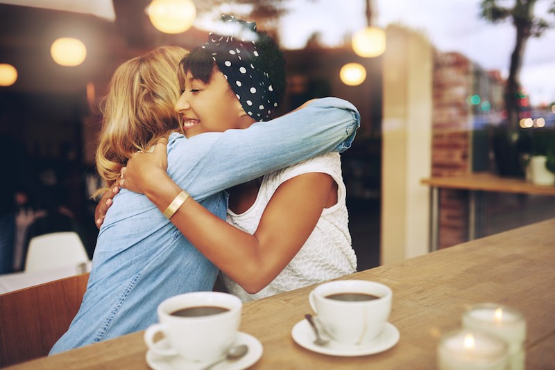 friends-hugging-cafe-restaurant
