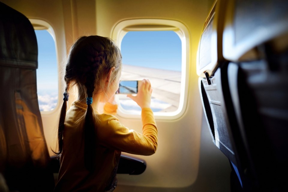 girl-window-airplane-travel