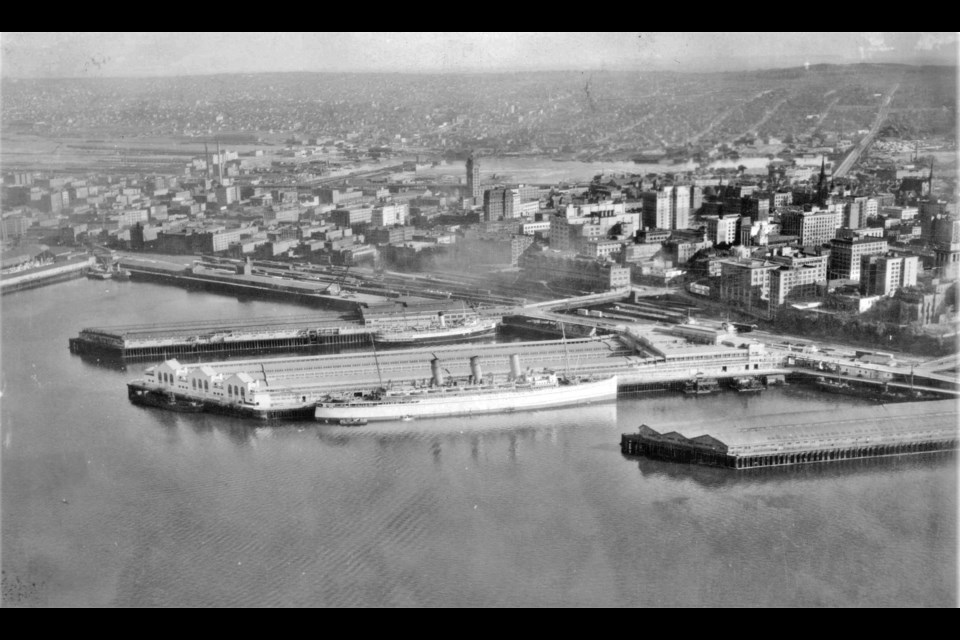 Ships docked at the CPR piers in 1927. Nowadays this is where Canada Place is. Just behind the piers the CPR station can be seen; it's now Waterfront station.
Reference code: AM358-S1---: CVA 152-11.1