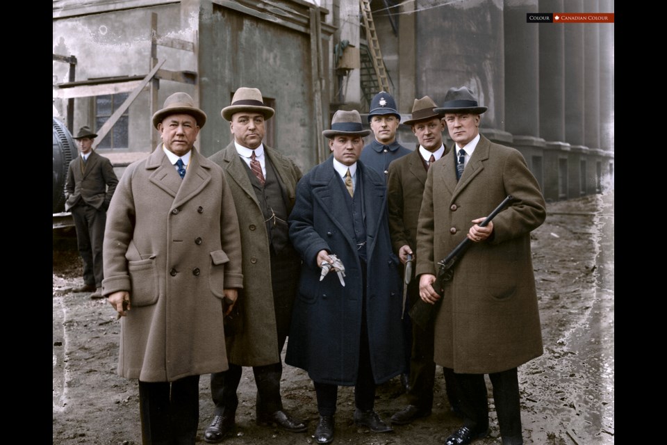 Taken by photographer Stuart Thomson on January 25, 1924, the officers hold solemn expressions as well as an assortment of recently used weaponry. 