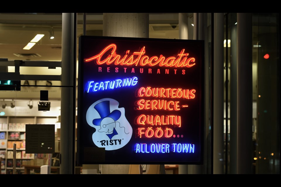 The neon sign in the window of Indigo is a replica of The Aristocratic sign that hung on the building in the same spot in the 1930 and 40s. It's been there since the store opened as Chapters.