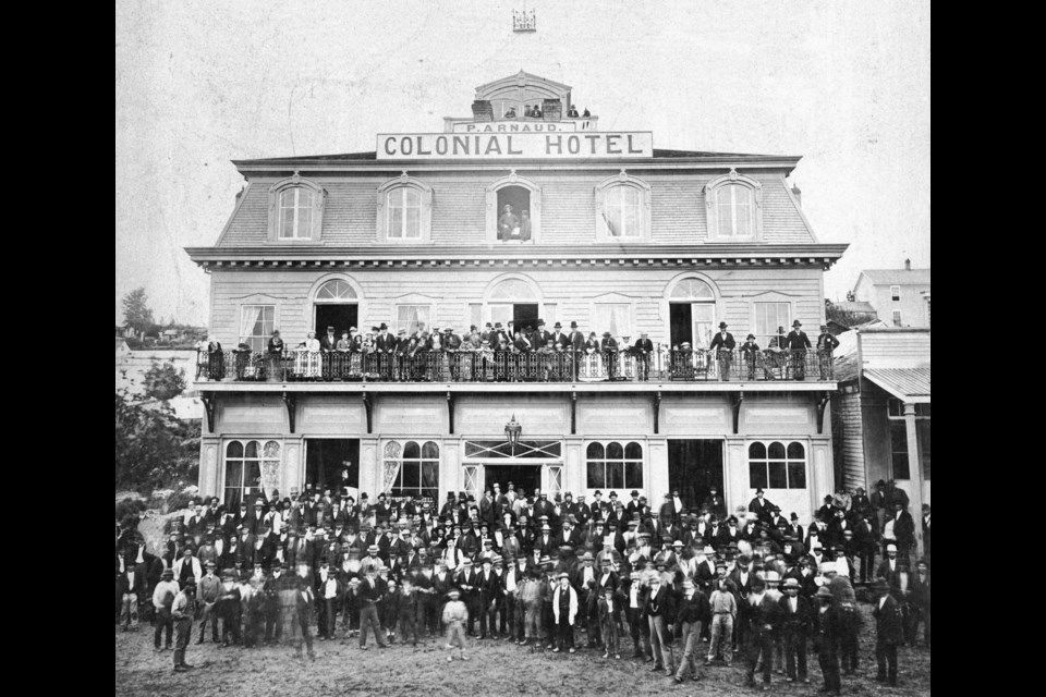 A large group stands infront of the Colonial Hotel in New Westminster in 1878. Reference code: AM336-S3-2-: CVA 677-452