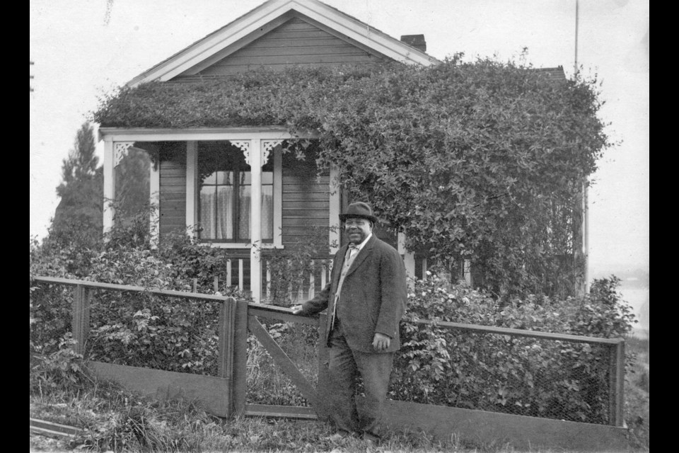 Vancouver's first life guard, Joe Fortes, in front of his cottage on English Bay at the foot of Bidwell Street. Reference code: AM54-S4-: Bu P111