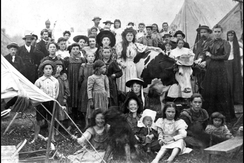 You're probably reading this caption after taking a look at the photo, but take a second look for anything unusual. Did you see the cow they brought with them on their picnic? This group came from Mount Pleasant in 1896 for a picnic at what's now known as Kitsilano Beach. Reference code AM54-S4-: Be P98