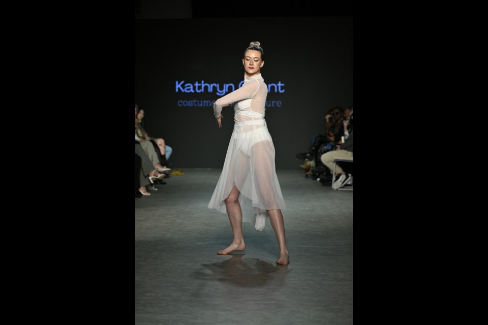The first look in Kathryn Grant's collection for VFW SS24 is a a white mesh dress with a flowy skirt and a wrap-around detail covering the bust and hugging the waist. The design resembles a dancer's ensemble. At a later stage in her life, Grant changed careers and entered the fashion world as a designer. 