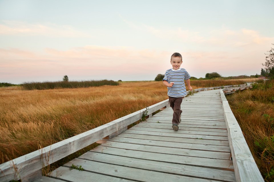 boy-running-park-path-vancouver-bc-nature