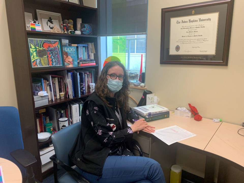 Dr. Eva Moore at desk