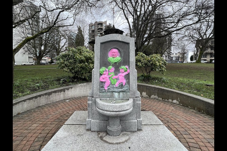Vancouver police are investigating after someone graffitied the monument to iconic local Joe Fortes with bright paint in March 2022. 