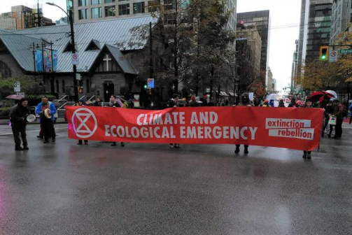 The protestors first gathered in Nelson Park and were joined by David Suzuki before they marched to occupy the intersection of Burrard and Georgia streets.