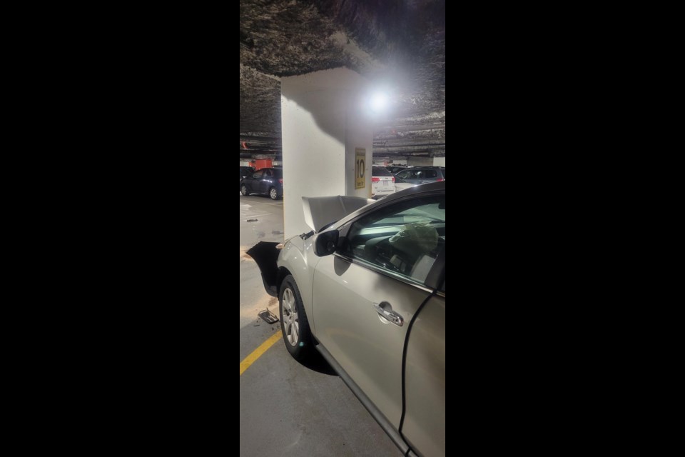 A driver was "knocked out" after he crashed into a support beam in the underground parkade at the Vancouver Public Library. 