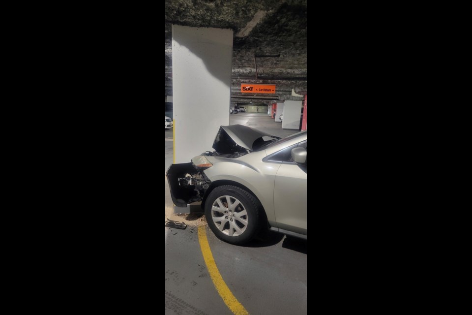 A driver was "knocked out" after he crashed into a support beam in the underground parkade at the Vancouver Public Library. 