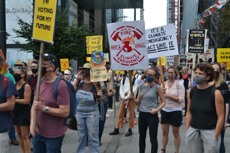 Signs focused on climate change and the Transmountain pipeline expansion.