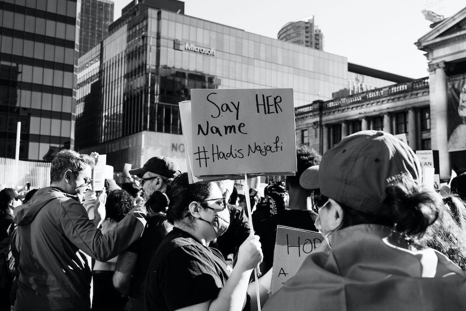 The protest at the Vancouver Art Gallery saw people hundreds of people carrying signs with Amini's name.