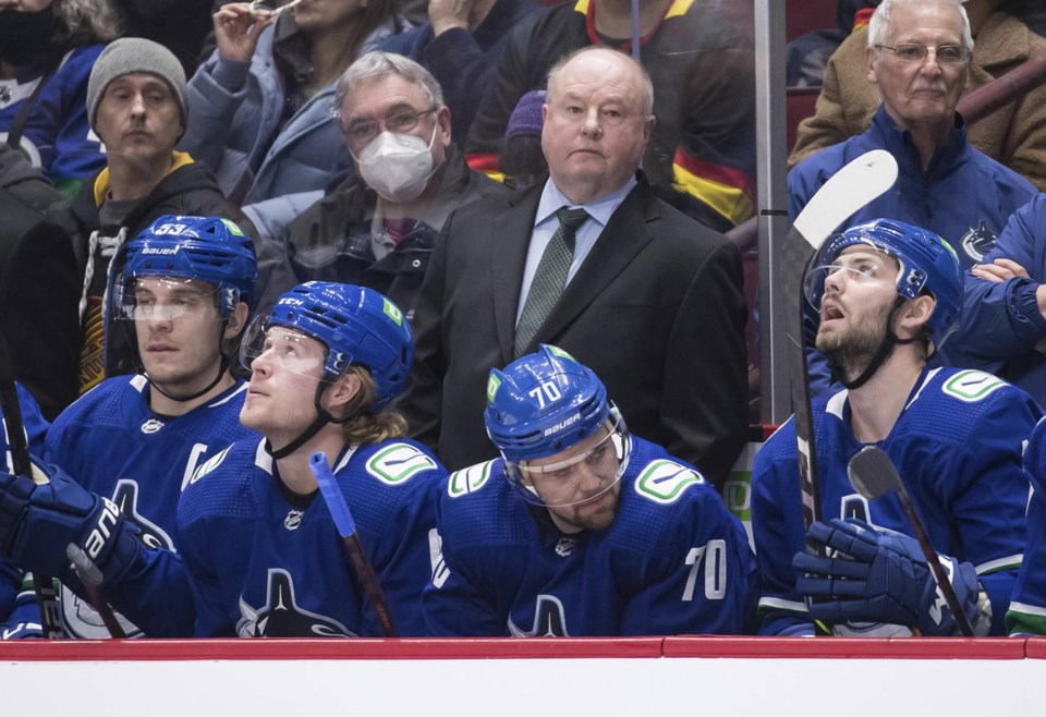 boudreau behind canucks bench darryl dyck cp