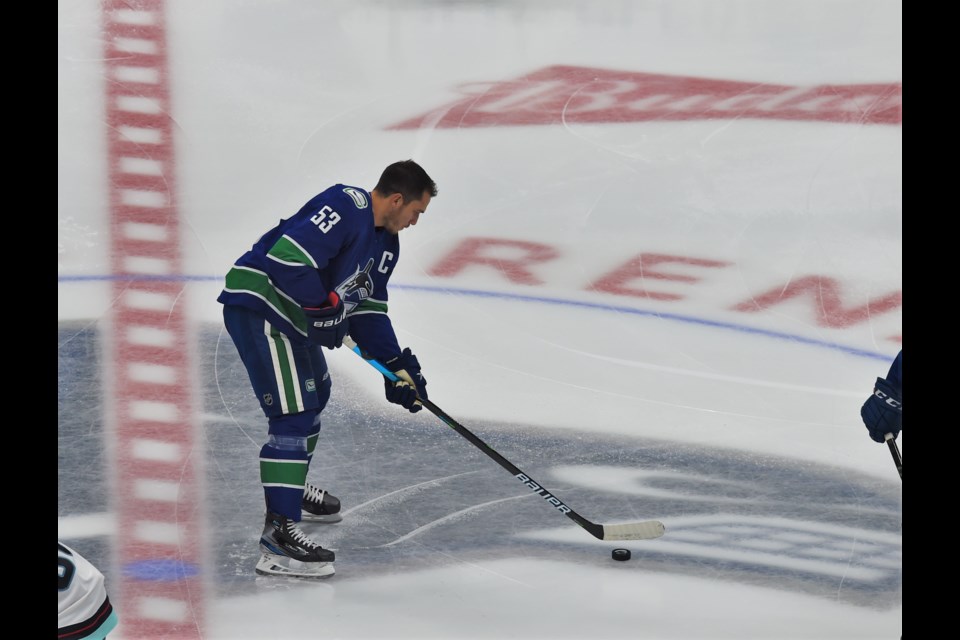 Captain Bo Horvat works on his stickhandling during the warm-up.