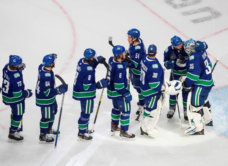 canucks celebrate 2020 playoff win jason franson cp