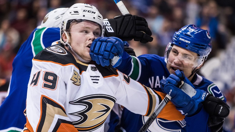 NHL-Canucks-Schenn-fights-Ducks-Jones darryl dyck cp