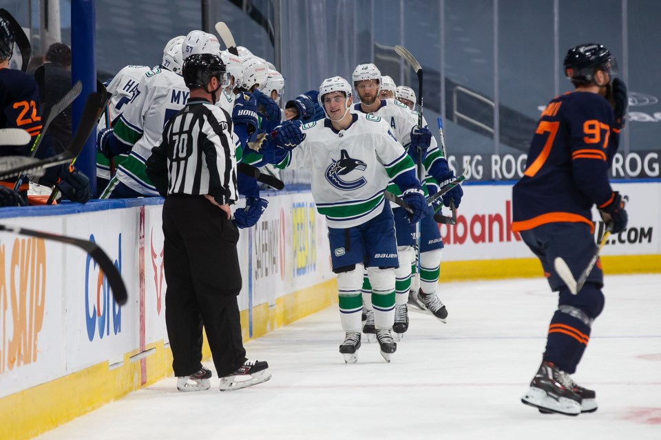 nils hoglander goal celebration bench canucks twitter